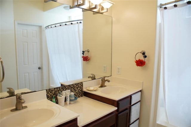 bathroom featuring curtained shower, decorative backsplash, and vanity