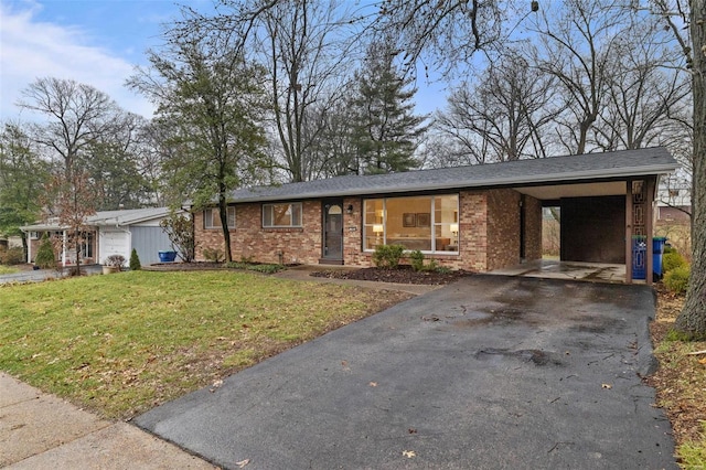 ranch-style house with a carport and a front yard