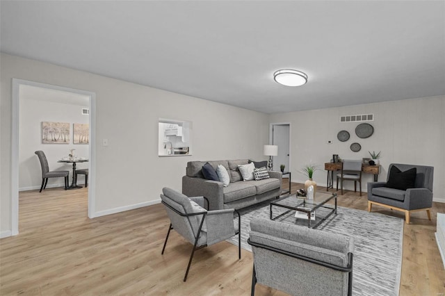 living room with light hardwood / wood-style floors