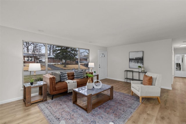 living room with light hardwood / wood-style flooring