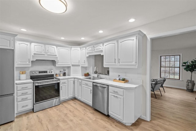 kitchen featuring white cabinetry, sink, and stainless steel appliances