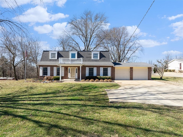 view of property with a garage, brick siding, concrete driveway, a balcony, and a front yard