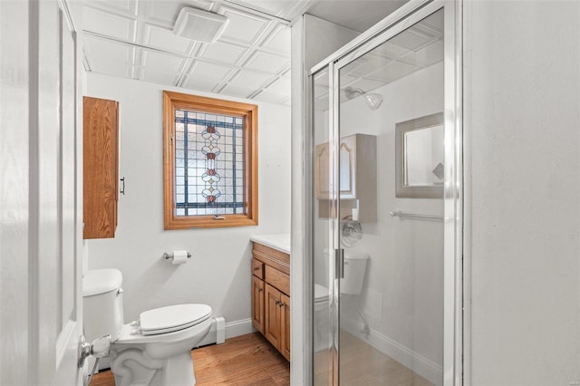 bathroom with toilet, a shower stall, baseboards, and an ornate ceiling