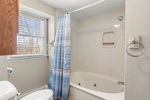 full bathroom with a combined bath / shower with jetted tub, a textured wall, a textured ceiling, and toilet