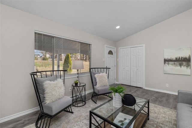 living area with lofted ceiling, baseboards, wood finished floors, and recessed lighting