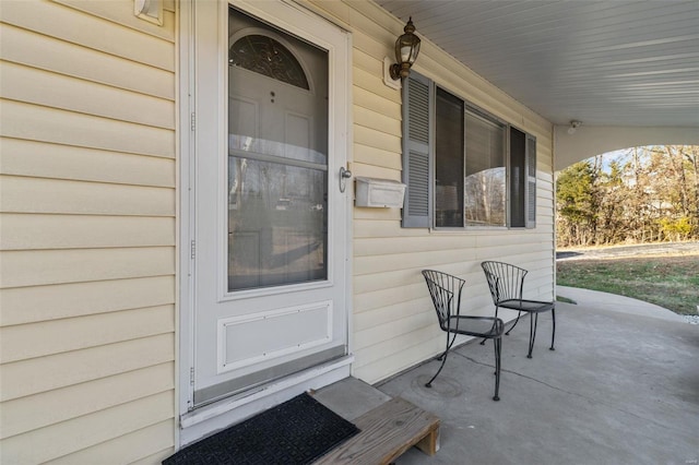 entrance to property with covered porch