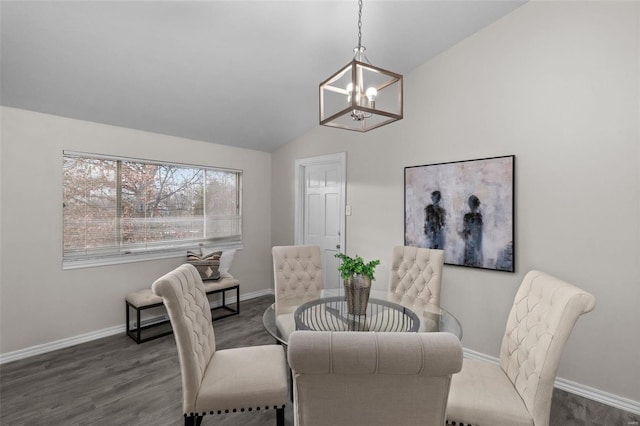 dining room with lofted ceiling, an inviting chandelier, wood finished floors, and baseboards