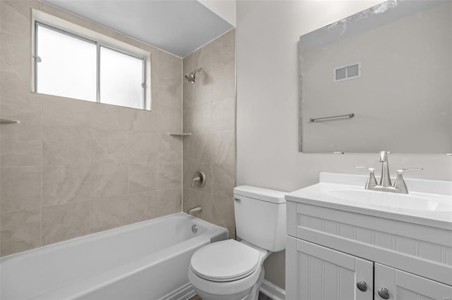 full bathroom featuring visible vents, washtub / shower combination, vanity, and toilet