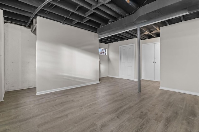 basement with wood finished floors and baseboards