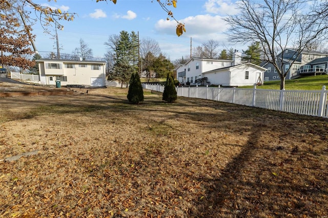 view of yard featuring a residential view and fence