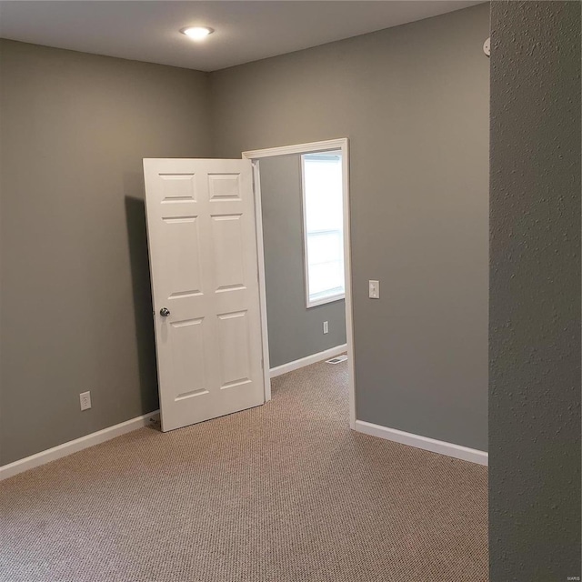 view of carpeted spare room