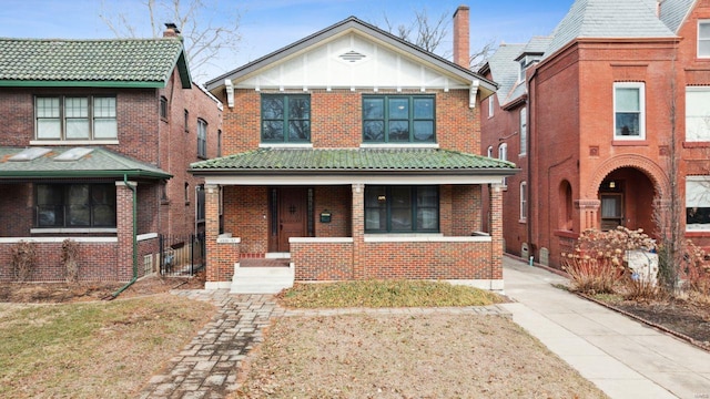 view of front of home featuring brick siding