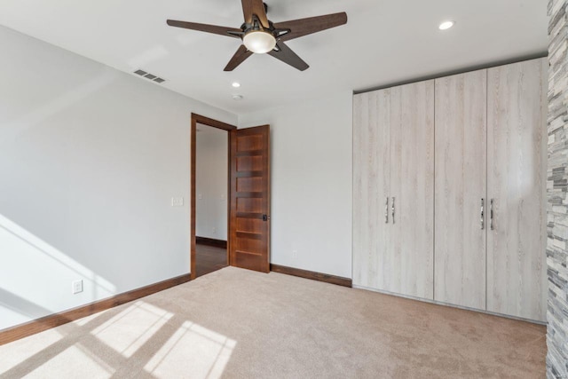 unfurnished bedroom featuring recessed lighting, visible vents, dark carpet, and baseboards