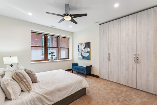 bedroom featuring light carpet, ceiling fan, and recessed lighting