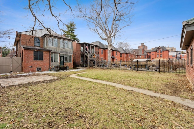 view of yard with a residential view and fence