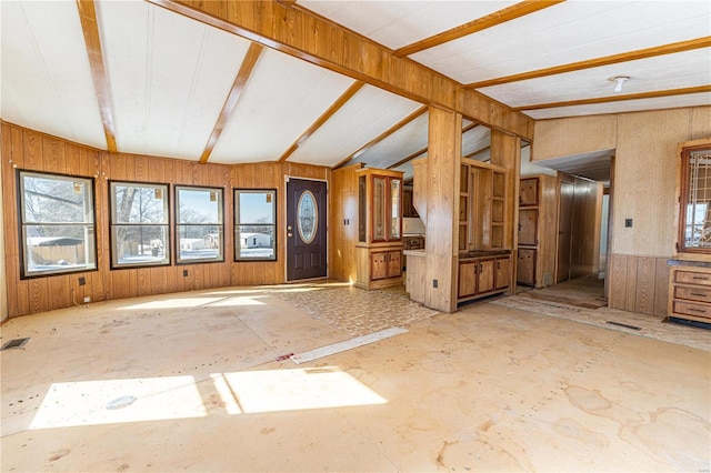 foyer featuring lofted ceiling with beams