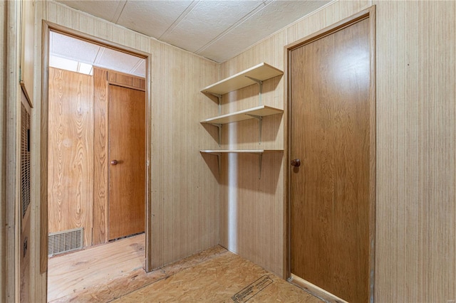 interior space featuring wooden walls