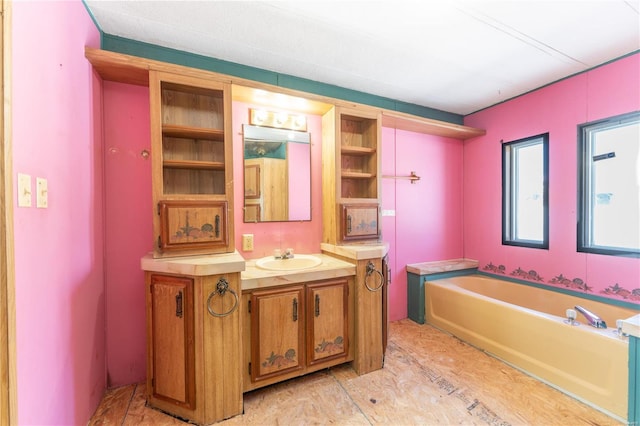 bathroom with a bath and vanity