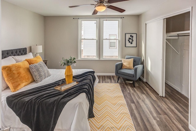 bedroom with a closet, ceiling fan, and dark hardwood / wood-style floors