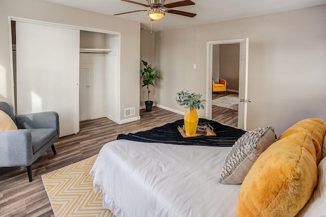 bedroom featuring hardwood / wood-style floors, a closet, and ceiling fan