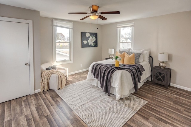 bedroom featuring ceiling fan and dark hardwood / wood-style floors