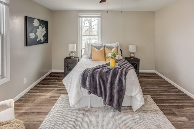 bedroom featuring dark hardwood / wood-style floors and ceiling fan