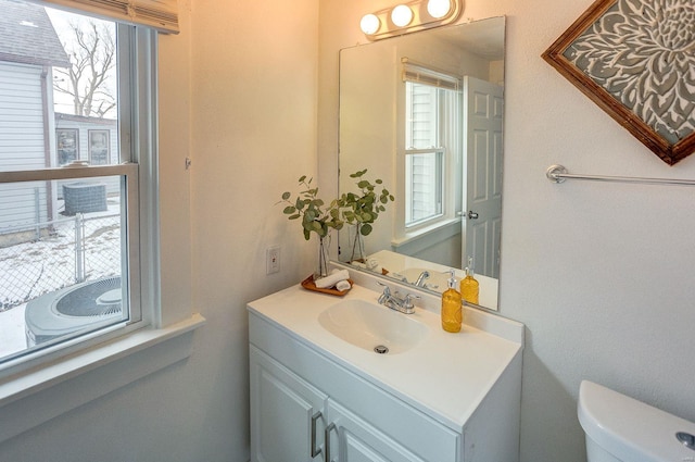 bathroom featuring toilet and vanity