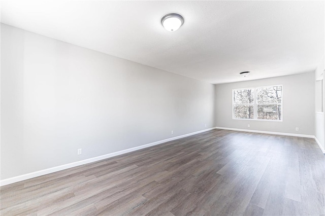 spare room with hardwood / wood-style floors