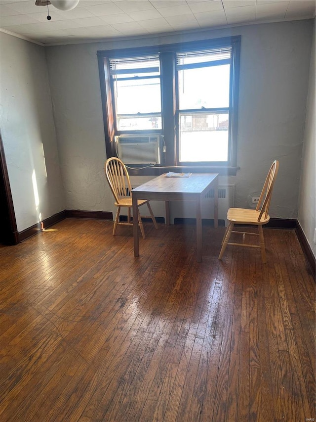 unfurnished room featuring cooling unit and wood-type flooring