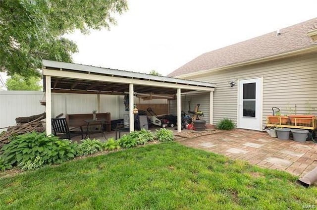 exterior space featuring a yard and a patio