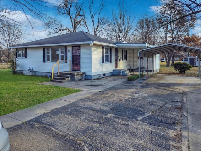 ranch-style house featuring a front yard and a carport