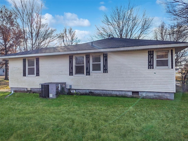 view of home's exterior featuring a lawn and cooling unit