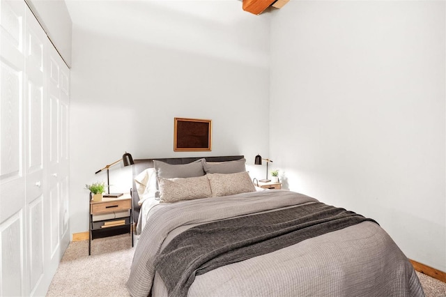 carpeted bedroom featuring a closet