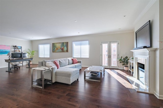 living room with dark wood-type flooring, ornamental molding, and french doors