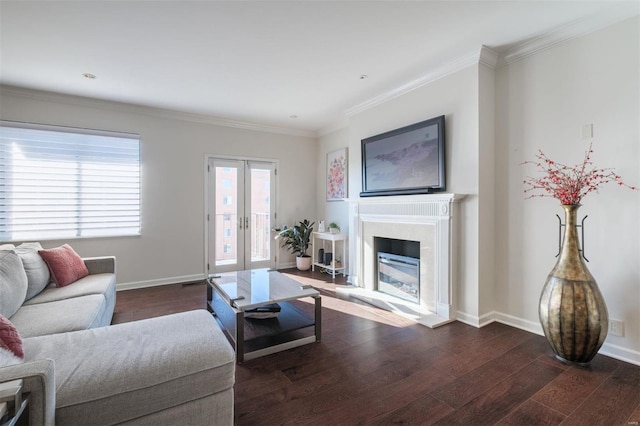 living room with dark hardwood / wood-style flooring, crown molding, and french doors