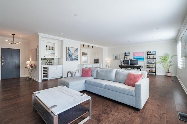 living room with wine cooler, dark hardwood / wood-style floors, and a notable chandelier