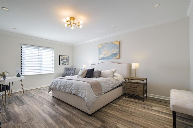 bedroom featuring dark hardwood / wood-style flooring, crown molding, and an inviting chandelier