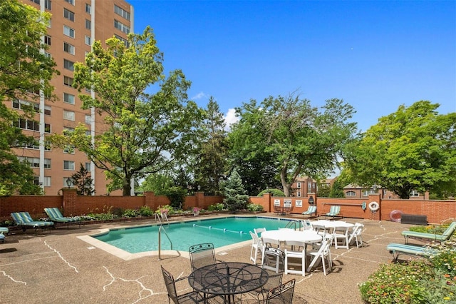 view of pool featuring a patio area