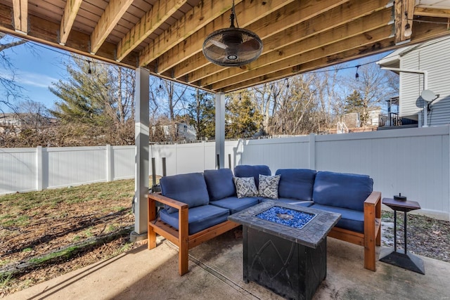 view of patio featuring an outdoor living space with a fire pit