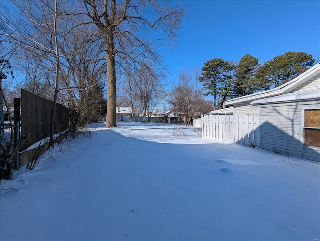 view of yard layered in snow