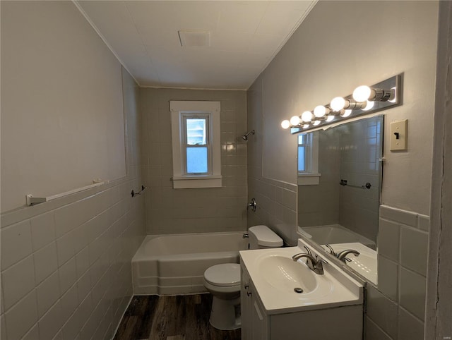 full bathroom with toilet, vanity, tile walls, and hardwood / wood-style flooring