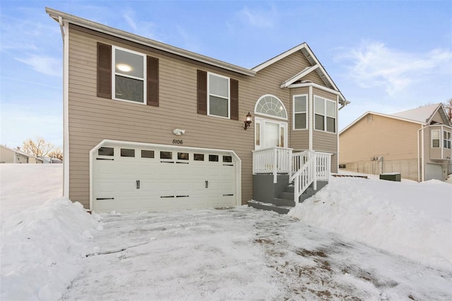 bi-level home featuring a garage