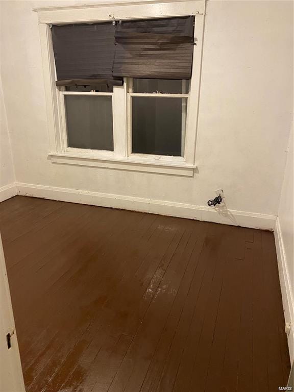 empty room with hardwood / wood-style floors