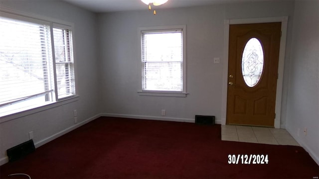 foyer with light tile patterned floors