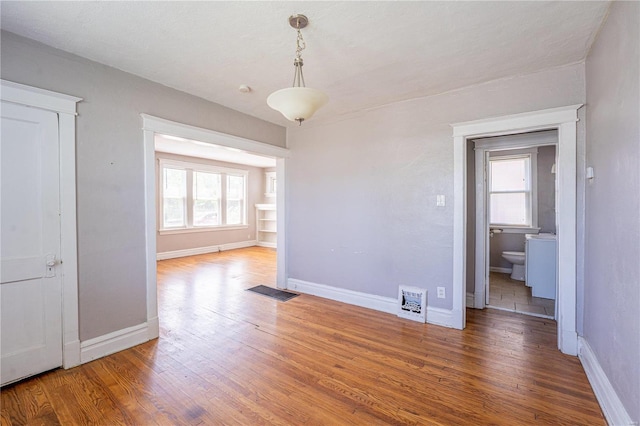 unfurnished dining area featuring hardwood / wood-style floors