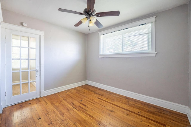 spare room with wood-type flooring and ceiling fan