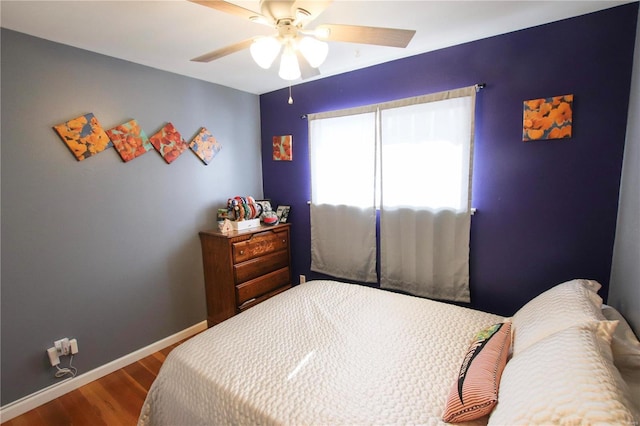 bedroom featuring hardwood / wood-style floors and ceiling fan