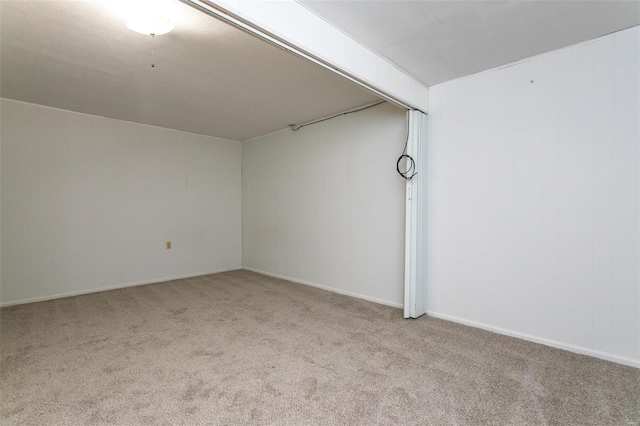 unfurnished room with light colored carpet