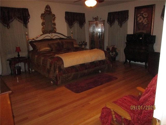 bedroom featuring hardwood / wood-style flooring and ceiling fan