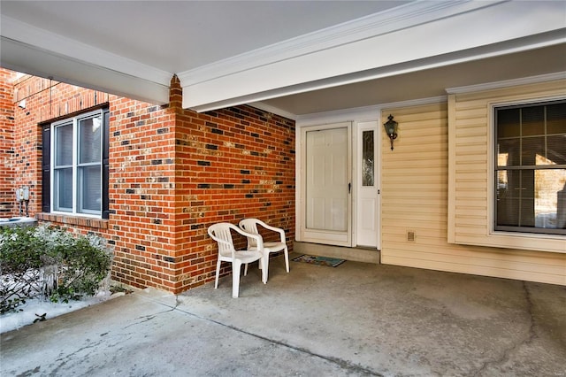 view of exterior entry featuring a porch